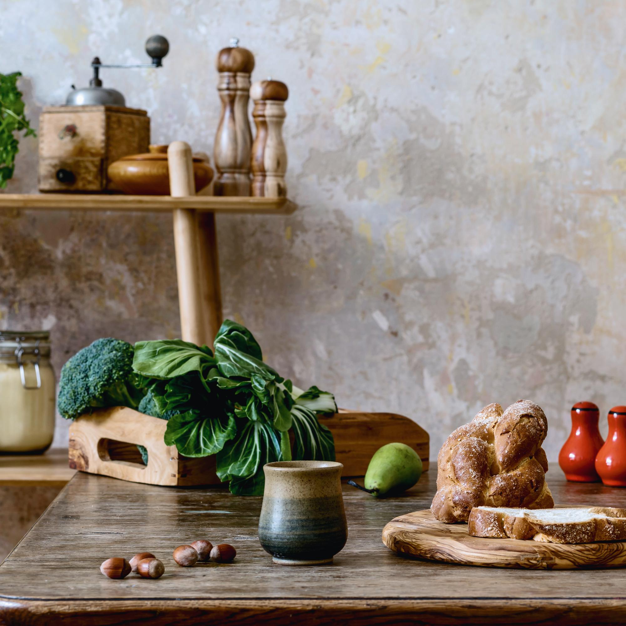 Rustic kitchen workspace with ingredients and utensils